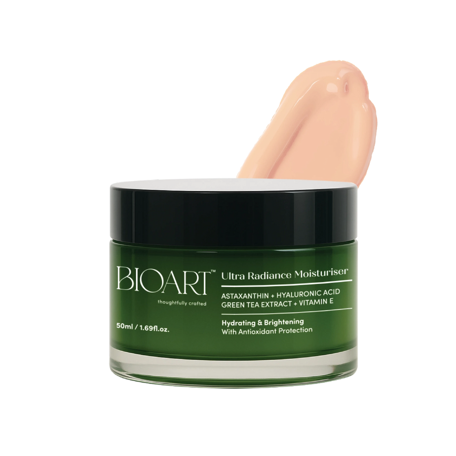 Green jar of BIOART Ultra Radiance Moisturizer with a hand applying cream on a white background