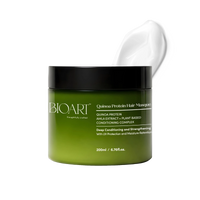Green hair mask jar with black lid on a white background