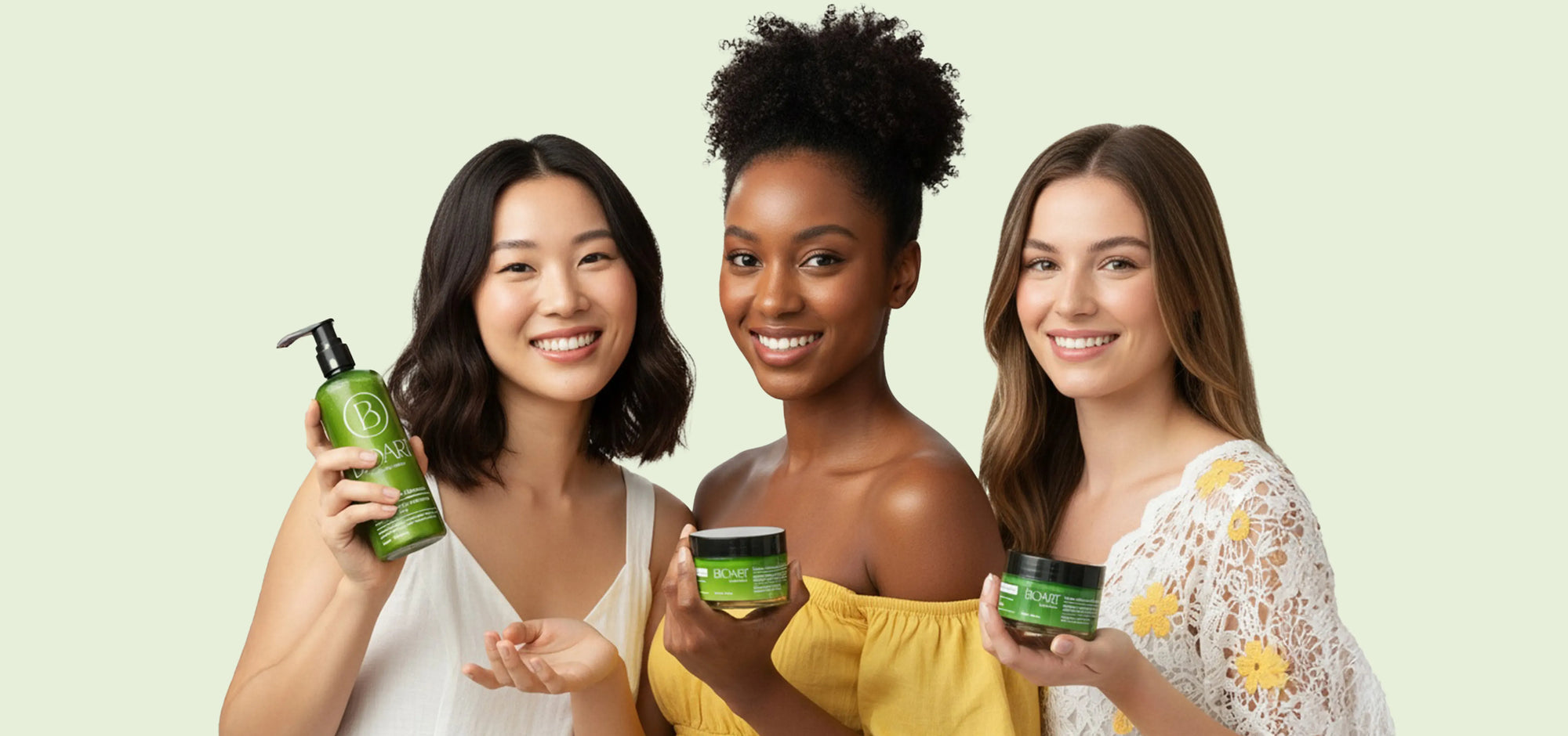 Three women holding green hair care products against a light green background