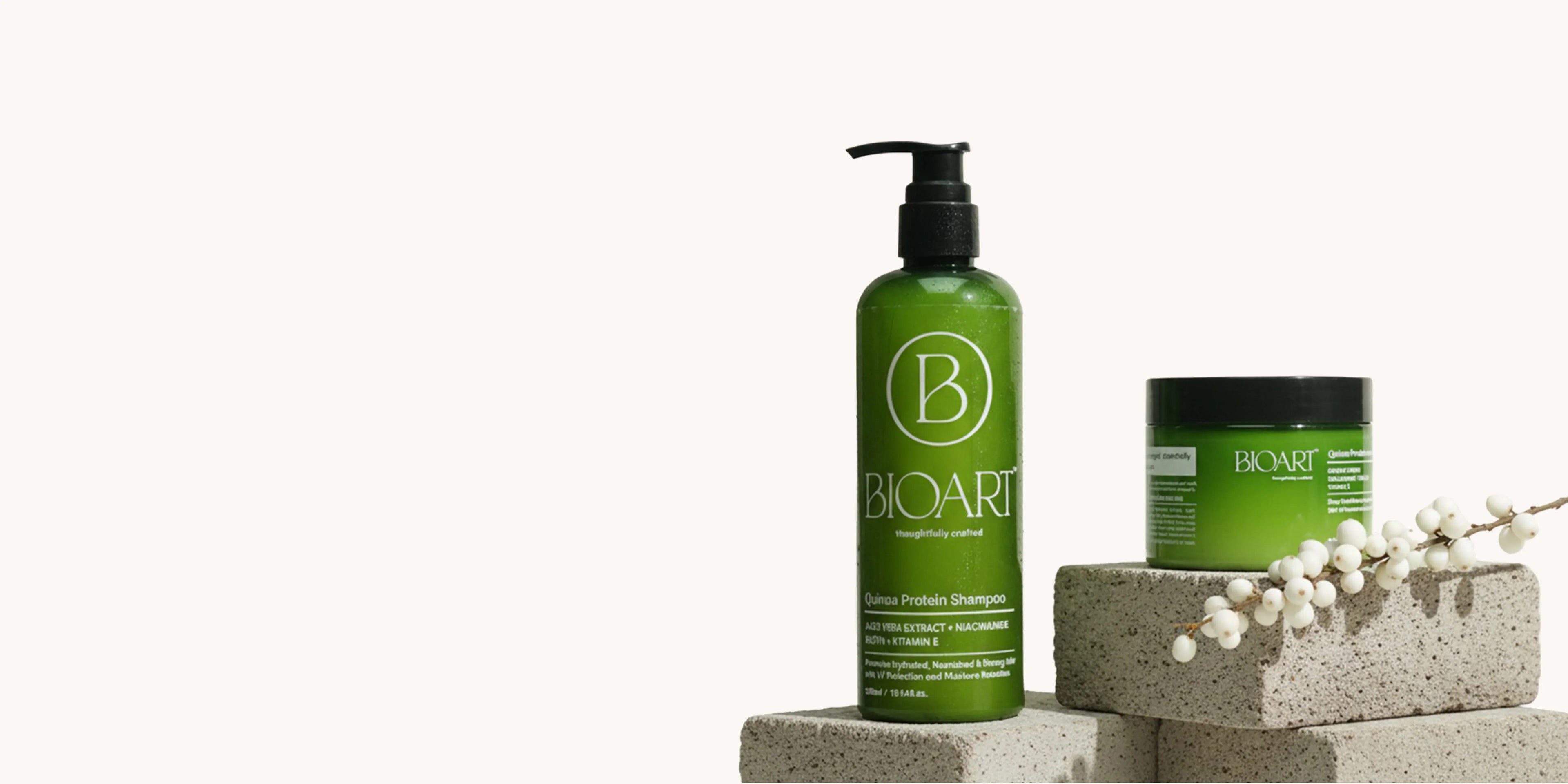 Green shampoo bottle and jar with 'BioArt' branding on a white background