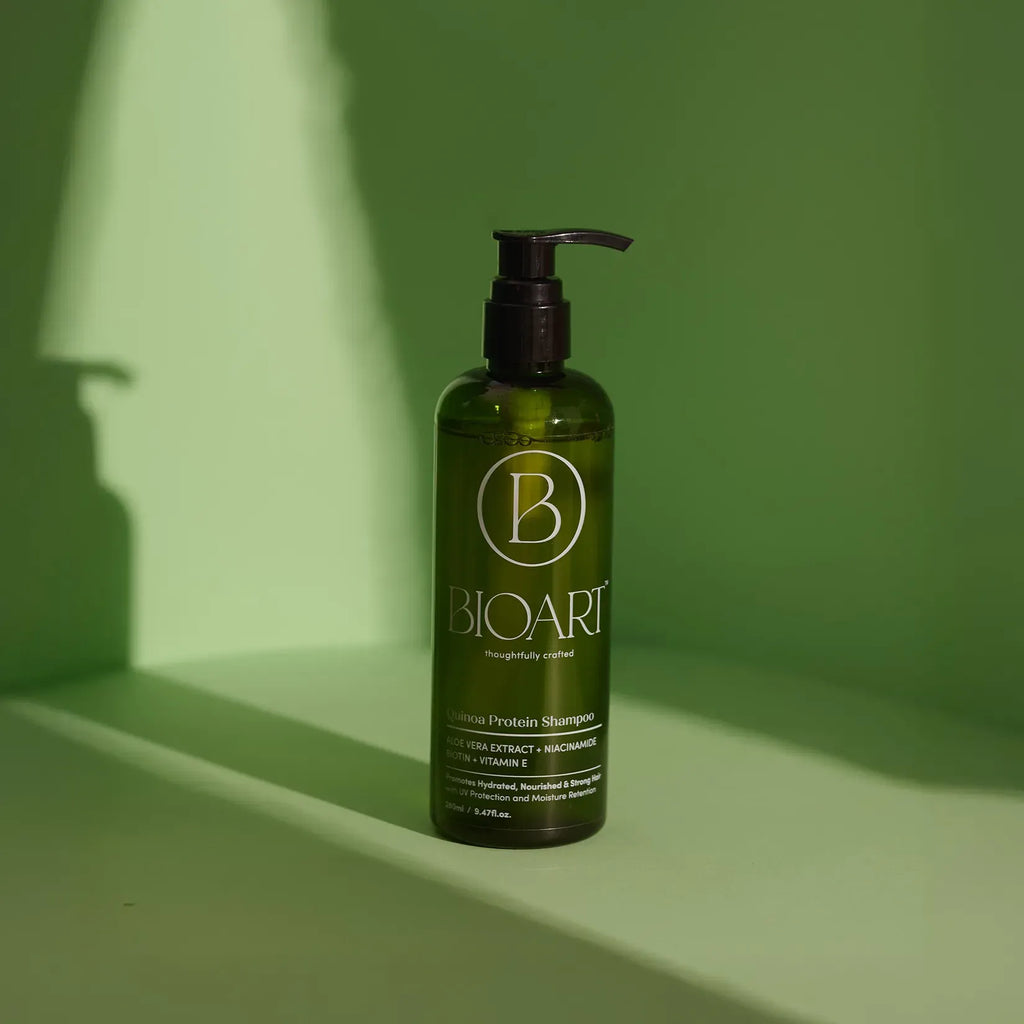 BioArt shampoo bottle on a green background