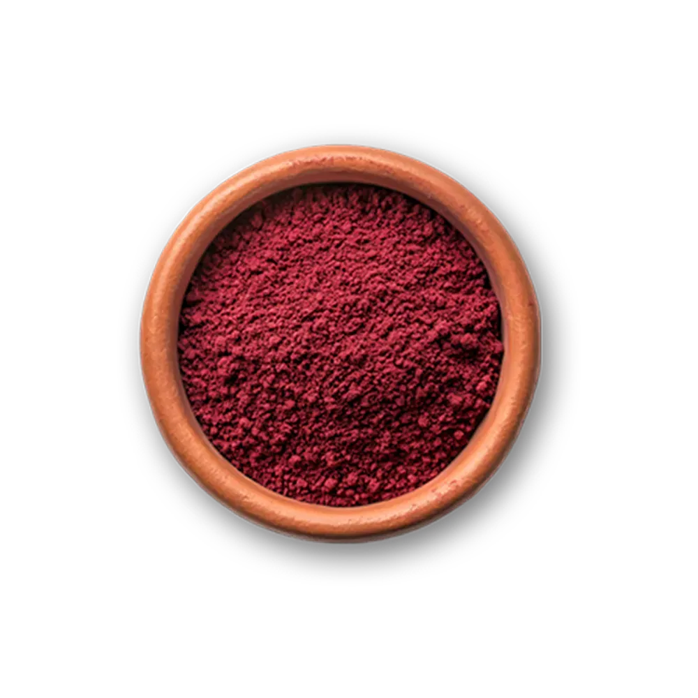 Red powder in a wooden bowl on a white background